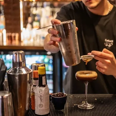 Metro - The Black Lion (West Hampstead) Bartender making a drink