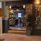 A wine fridge and seating area inside The Castle Hotel.