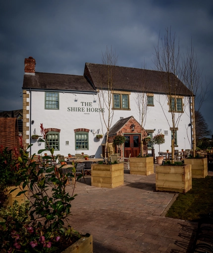 The beer garden and exterior of The Shire Horse.