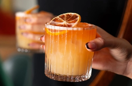 An interior shot of people enjoying drinks at the Ubiquitous Chip in Glasgow.