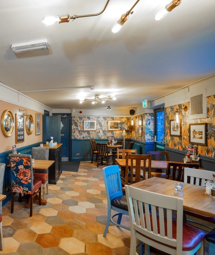The restaurant area of the Woodman Inn.