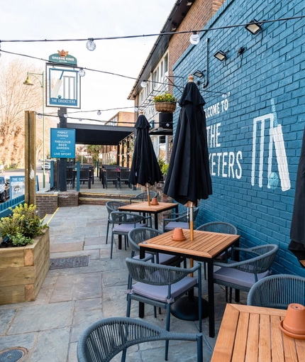 Exterior and beer garden of the Cricketers pub in Southwick