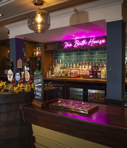 Interior bar area with a barrel next to the bar as part of the decor
