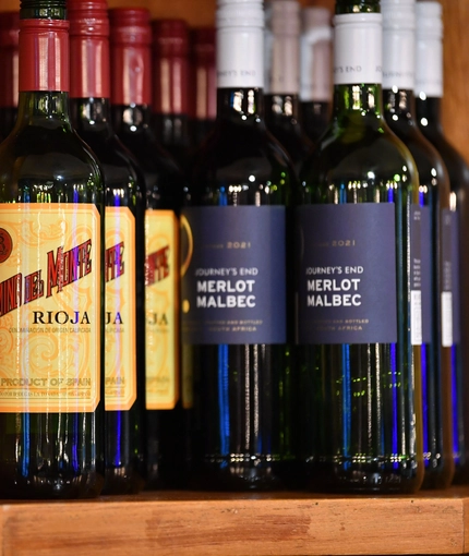 a close-up of wine bottles in a bar