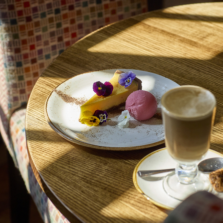 An image showing the rose petal and pistachio panna cotta and clementine tart at Chef & Brewer.