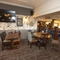 Interior dining area of a pub with a TV.
