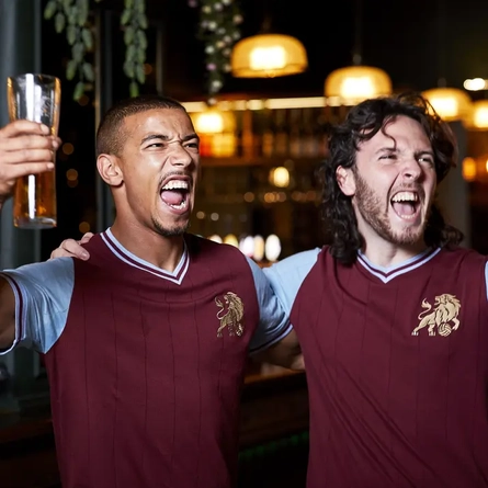 Friends enjoying football in the pub