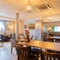 The interior restaurant and seating area with TV at the Poachers.