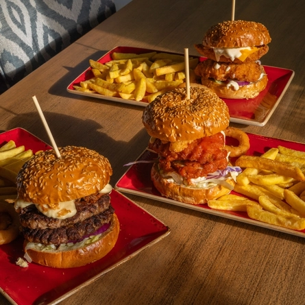 A served selection of burgers  available on the Hungry Horse Autumn Winter menu.