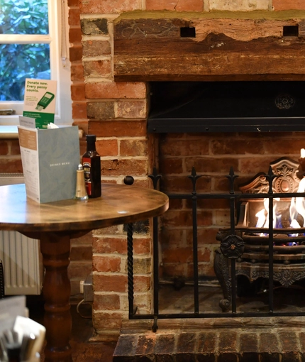 a close-up of a fireplace in a pub