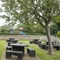 Exterior facade of a pub with a seating area with a play area.