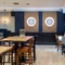 The interior restaurant, seating and games area with dart boards area at the Poachers.