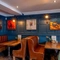 Comfy seating area within the restaurant at the George Abbot.