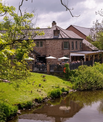 The exterior of The Malthouse Farm and the grounds surrounding it.