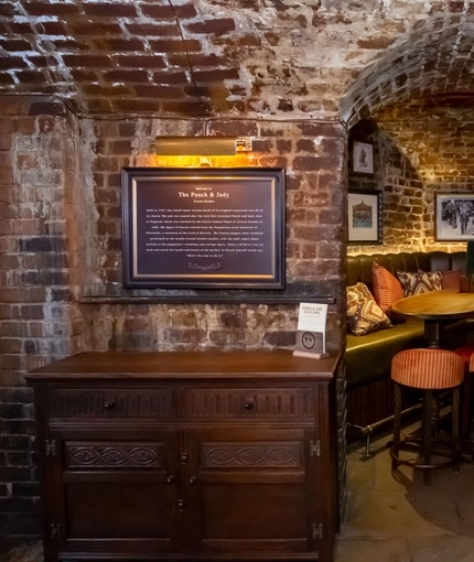 Interior of table with bar stools and sofa