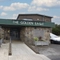 Exterior facade and car park of a pub.