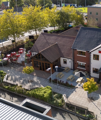 An aerial view image of the venue and surround area with outdoor seating and car park at The Castle View.