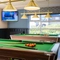The interior games area with pool table and TV at The Woodlands.