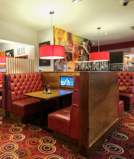 interior dining area of  a pub with a TV