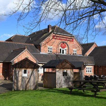 Exterior beer garden of a pub with a seating area.