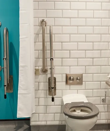 The interior accessible bathroom within one of the hotel rooms at The Churchill.