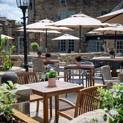 The exterior beer garden seating area of The Old Mill in Brighouse.