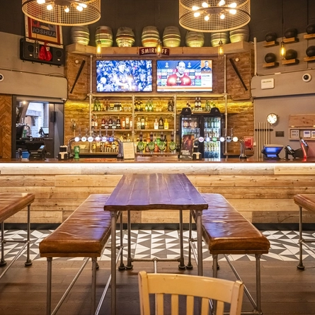 The interior bar and seating area with TV's at The Four Seasons.