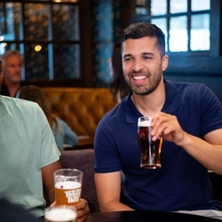 An image of 3 people sat within the interior seating area with drinks at a Community Pubs With Food venue.
