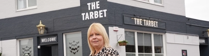 A woman stood outside The Tarbet, looking at the camera.