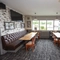Interior dining area of a pub with a TV.