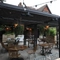 Undercover Exterior  Beer Garden seating area with wicker chairs and lots of plants