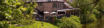 The exterior of The Malthouse Farm and the grounds surrounding it.
