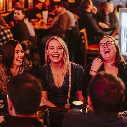 Guests laughing in the pub