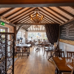 Interior restaurant with nice decor and curtain down the middle of the room