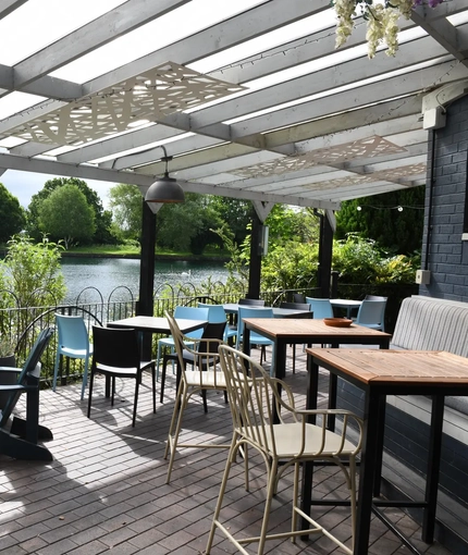 Exterior beer garden and seating area by the water