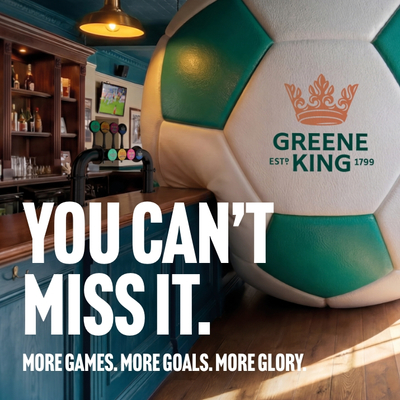 A banner promoting the new football season at Greene King Pub venues. The banner shows an interior of a Greene King Pub-branded sports bar featuring a giant football-shaped wall installation beside the bar. Large white text reads “YOU CAN’T MISS IT.” with smaller text underneath stating “MORE GAMES. MORE GOALS. MORE GLORY.” A television screen showing a football match is visible in the background above beer taps and shelves of bottles.