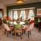 The interior restaurant seating area with tables, chairs and cushioned seating at The Farmhouse Kitchen Willington.