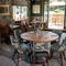 Some tables in the restaurant of the Three Horse Shoes.