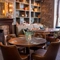 Some tables near a fireplace in the restaurant of Himley House.