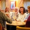 Guests sitting at a table inside The Pack Horse in Burnopfield, with glasses of wine on the table in front of them.
