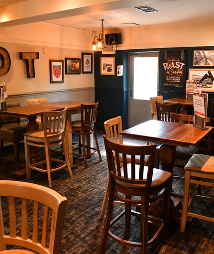 interior of the restaurant and seating area with TV