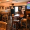 interior of the restaurant and seating area with TV