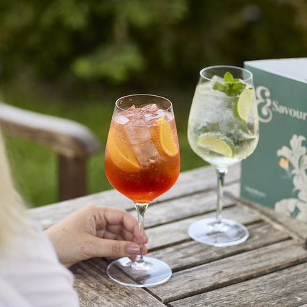 An exterior shot of people enjoying Spritz in a beer garden at a Chef & Brewer venue.
