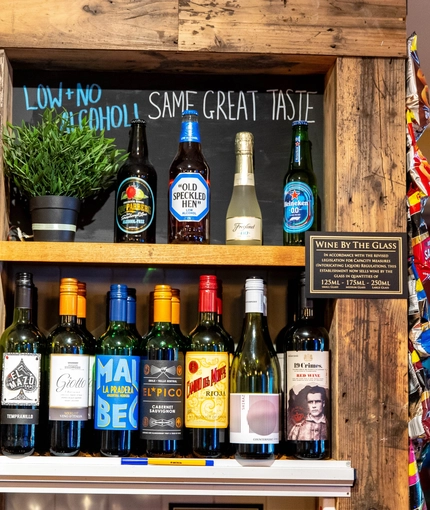 Interior bar of a pub with a wine rack.