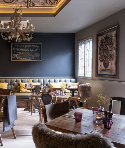 restaurant seating area with several tables set up for dining