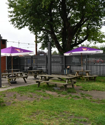 exterior beer garden of a pub with a seating area
