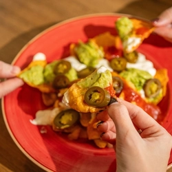 A served side of Nachos being enjoyed by customers at Hungry Horse venues.