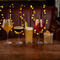 a few drinks sitting on a wooden table of a pub