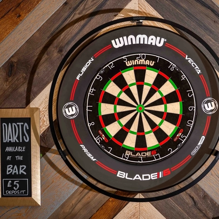 the interior games area with a close up of a dart board available to use at the Armstrongs.