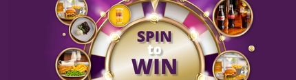 A banner showing the words "Spin to Win" next to a spin the wheel, surrounded by gold stars and images of main meals, drinks, and a dessert.
